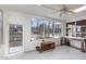 Sun Room features an exposed aggregate floor, large picture windows, an exterior door, and lots of natural light at 2118 Timberlake Dr, Raleigh, NC 27604