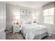 Bright bedroom featuring neutral walls, white accents, whimsical unicorn art and a sunny window at 213 Suburban Meadow Pass, Wendell, NC 27591