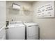 Efficient laundry room equipped with modern washer and dryer, plus stylish decor at 213 Suburban Meadow Pass, Wendell, NC 27591