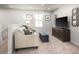 Cozy living room area featuring a sofa, TV, accent furniture and neutral paint at 213 Suburban Meadow Pass, Wendell, NC 27591