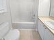 Clean bathroom featuring a white vanity, toilet, and tub with shower; modern design, perfect for relaxation at 2356 Bay Harbor Dr, Raleigh, NC 27604