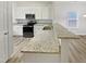 Modern kitchen with granite countertops, white cabinets, and stainless steel appliances, perfect for cooking and entertaining at 2356 Bay Harbor Dr, Raleigh, NC 27604