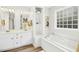 Bright white bathroom with a combination tub and shower at 248 Sweet Bay Pl, Carrboro, NC 27510