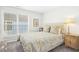 Cozy bedroom with plush carpet, large window, and tufted headboard at 248 Sweet Bay Pl, Carrboro, NC 27510