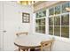 Cozy breakfast nook with a round table, natural light, and peaceful window view at 248 Sweet Bay Pl, Carrboro, NC 27510
