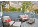 Spacious deck with comfortable seating and a view of the lush backyard and wooded area at 248 Sweet Bay Pl, Carrboro, NC 27510