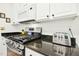 Contemporary kitchen with granite counters and stainless appliances, including range and microwave at 248 Sweet Bay Pl, Carrboro, NC 27510