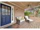 Charming front porch with brick accents, comfortable seating, and a ceiling fan for warm days at 248 Sweet Bay Pl, Carrboro, NC 27510
