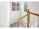 Bright stairwell with natural light and hardwood railing, offering a welcoming transition at 248 Sweet Bay Pl, Carrboro, NC 27510