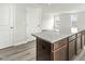 Granite island and two closed white doors next to an open space, with two windows at 265 Day Farm Dr, Lillington, NC 27546