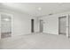 Large main bedroom featuring carpet flooring and three doors leading to a walk-in closet and the main bathroom at 265 Day Farm Dr, Lillington, NC 27546
