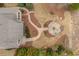 Aerial view showcasing landscaped backyard, fire pit area, and inviting outdoor living space at 2675 Beckwith Rd, Apex, NC 27523