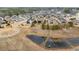 Community aerial view featuring pond, walking path, and firepit, highlighting outdoor living amenities at 2675 Beckwith Rd, Apex, NC 27523