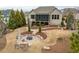 Beautiful backyard with a patio, fire pit, and lush landscaping in a private setting at 2675 Beckwith Rd, Apex, NC 27523