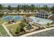 Aerial view showcasing a pool, playground, tennis courts, and luxurious community amenities at 2675 Beckwith Rd, Apex, NC 27523