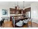 Stylish kitchen with a dark island, stainless steel appliances, and unique patterned backsplash at 2675 Beckwith Rd, Apex, NC 27523