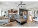 Bright living room featuring modern furnishings and an open floor plan leading into the kitchen at 2675 Beckwith Rd, Apex, NC 27523