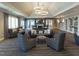 Comfortable lounge area with plush seating, a fireplace, and elegant decor at 2675 Beckwith Rd, Apex, NC 27523