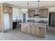 Spacious kitchen with a large center island, stainless steel appliances, and ample cabinet space at 2833 Faucette Ln, Burlington, NC 27217