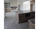 Modern kitchen showcasing an island with granite countertops and ample cabinet space at 2833 Faucette Ln, Burlington, NC 27217