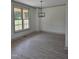 Bright living room featuring stylish light fixture, and hardwood floors at 2833 Faucette Ln, Burlington, NC 27217