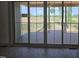 View from the interior to the covered patio and backyard at 2833 Faucette Ln, Burlington, NC 27217