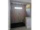 Modern walk-in shower featuring tiled walls, a built-in bench, and a sleek black shower floor at 2833 Faucette Ln, Burlington, NC 27217