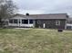 Spacious backyard with a fenced in patio and a screened in porch at 300 W Carr St, Mebane, NC 27302
