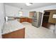 Bright kitchen featuring stainless steel appliances, granite countertops and modern fixtures at 300 W Carr St, Mebane, NC 27302
