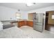 Bright kitchen featuring stainless steel appliances, granite countertops and modern fixtures at 300 W Carr St, Mebane, NC 27302