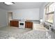 Well lit kitchen with modern appliances and updated cabinets at 300 W Carr St, Mebane, NC 27302