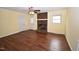 Bright living room with wood floors, brick fireplace and lots of natural light at 300 W Carr St, Mebane, NC 27302
