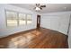 Inviting living room with ample natural light, wood floors, and multiple closets at 300 W Carr St, Mebane, NC 27302
