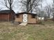 Outdoor shed with a quaint design in a spacious backyard at 300 W Carr St, Mebane, NC 27302