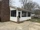 Enclosed sun room addition with screened windows, providing an indoor-outdoor living space at 300 W Carr St, Mebane, NC 27302