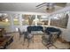 Cozy sunroom with tile flooring and ample seating, perfect for relaxation and entertaining at 300 W Carr St, Mebane, NC 27302