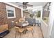 Cozy sunroom with tile flooring and space for seating or dining at 300 W Carr St, Mebane, NC 27302