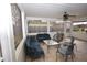 Cozy sunroom with comfortable seating and a ceiling fan, perfect for relaxation at 300 W Carr St, Mebane, NC 27302