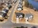 Stunning aerial view of a modern home near a serene lake at 3215 Jones Lake Rd, Fuquay Varina, NC 27526