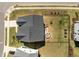 An aerial view shows the home, backyard fire pit, and surrounding landscaping at 3215 Jones Lake Rd, Fuquay Varina, NC 27526