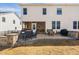 Beautiful backyard with a stone fire pit area, patio, screened porch, and outdoor seating at 3215 Jones Lake Rd, Fuquay Varina, NC 27526