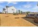 Green backyard includes a stone fire pit, a patio, and professional landscaping for outdoor living at 3215 Jones Lake Rd, Fuquay Varina, NC 27526