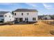 Expansive backyard with a stone fire pit, patio, and screened porch is perfect for entertaining at 3215 Jones Lake Rd, Fuquay Varina, NC 27526