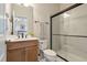 Well-lit bathroom with a walk-in shower and modern vanity at 3215 Jones Lake Rd, Fuquay Varina, NC 27526