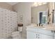 Bright bathroom with a white vanity, quartz countertop and modern fixtures, providing a clean and functional space at 3215 Jones Lake Rd, Fuquay Varina, NC 27526