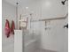 Modern shower with white marble style tile, glass enclosure, and built-in niche and bench at 3215 Jones Lake Rd, Fuquay Varina, NC 27526