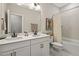 Bathroom with double sink vanity, white countertops, and a bathtub-shower combo at 3215 Jones Lake Rd, Fuquay Varina, NC 27526