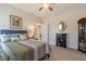 Inviting bedroom with a ceiling fan, soft lighting, and decorative accents at 3215 Jones Lake Rd, Fuquay Varina, NC 27526