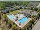 Inviting community pool area with multiple pools, sunshades, and a playground at 3215 Jones Lake Rd, Fuquay Varina, NC 27526