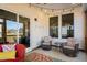 Cozy covered patio with comfortable seating, string lights, and a ceiling fan for outdoor enjoyment at 3215 Jones Lake Rd, Fuquay Varina, NC 27526